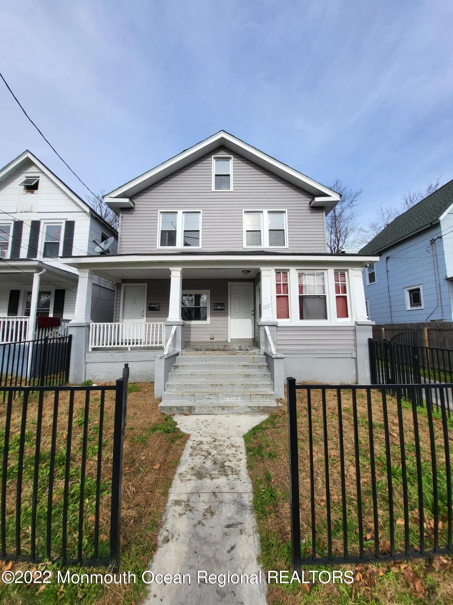 a front view of a house with a porch