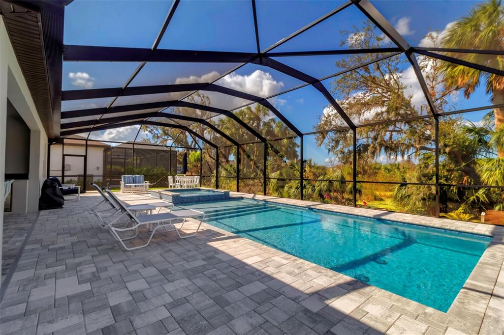 a view of swimming pool with a patio