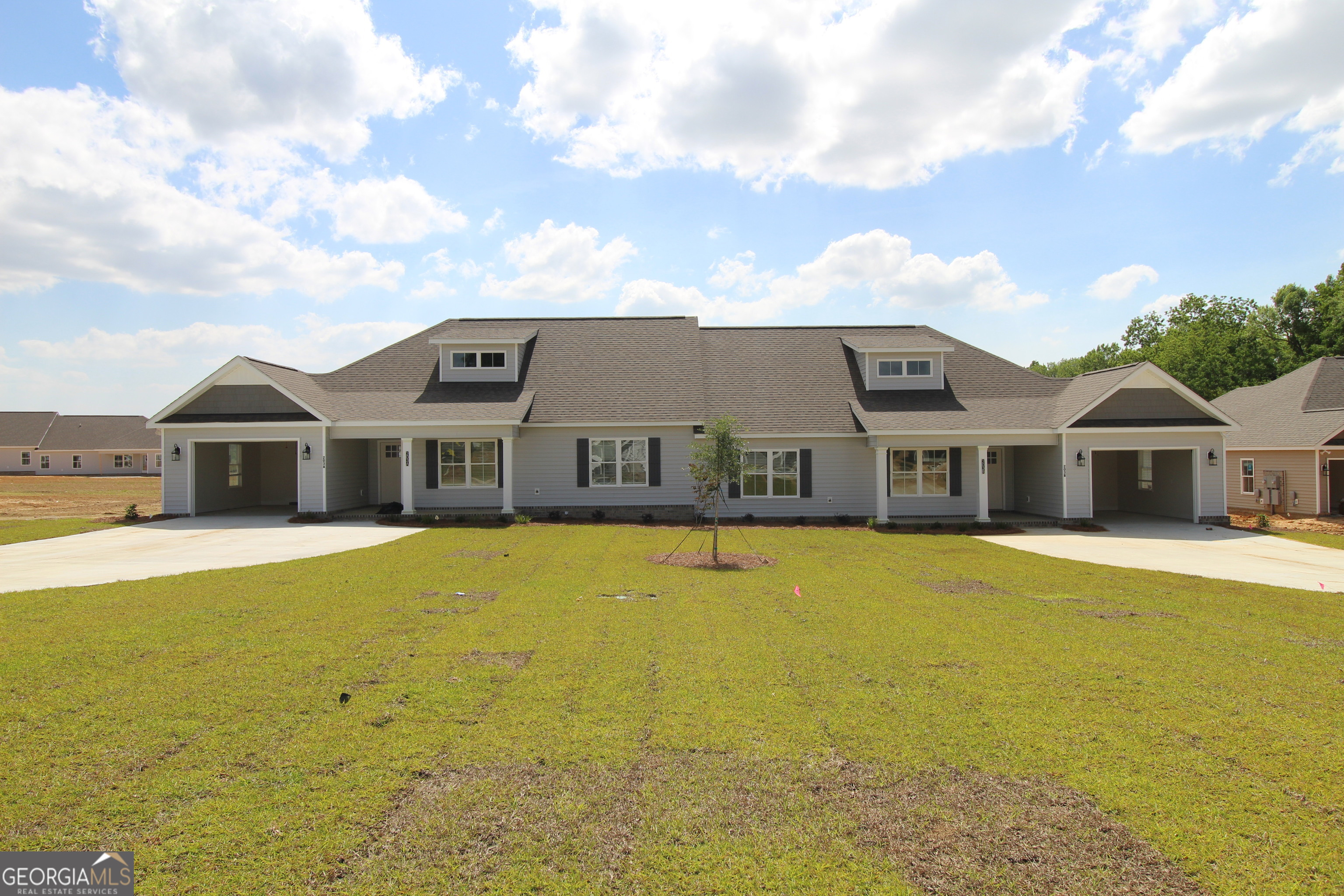 a front view of a house with a large pool