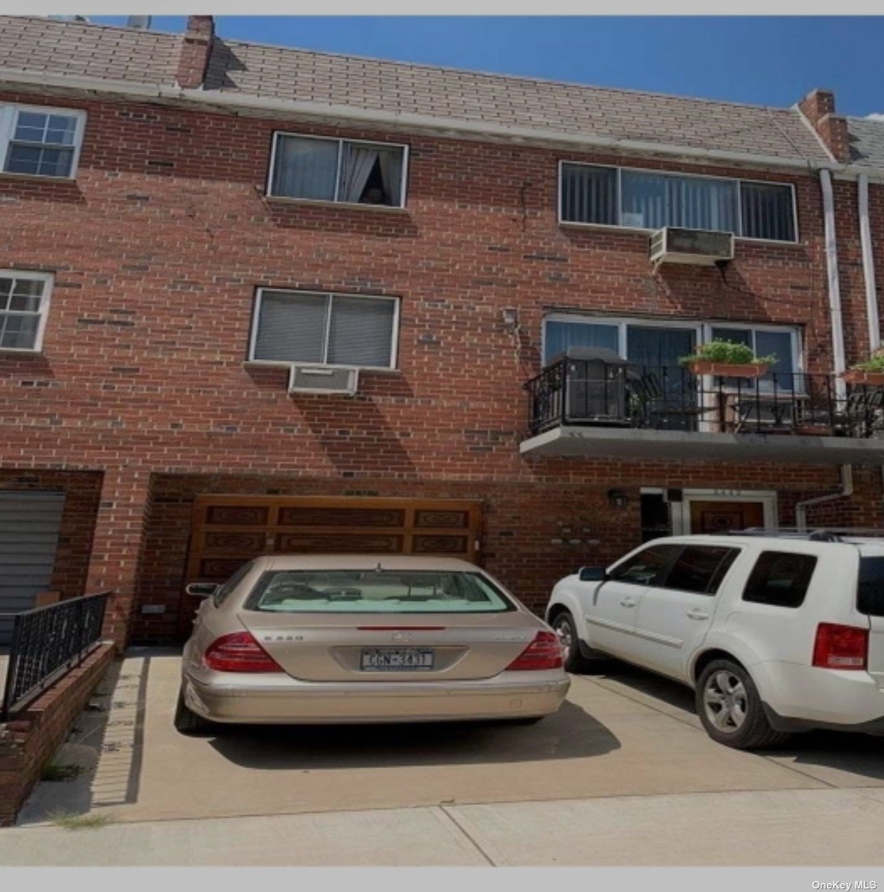 a front view of a house with parking space