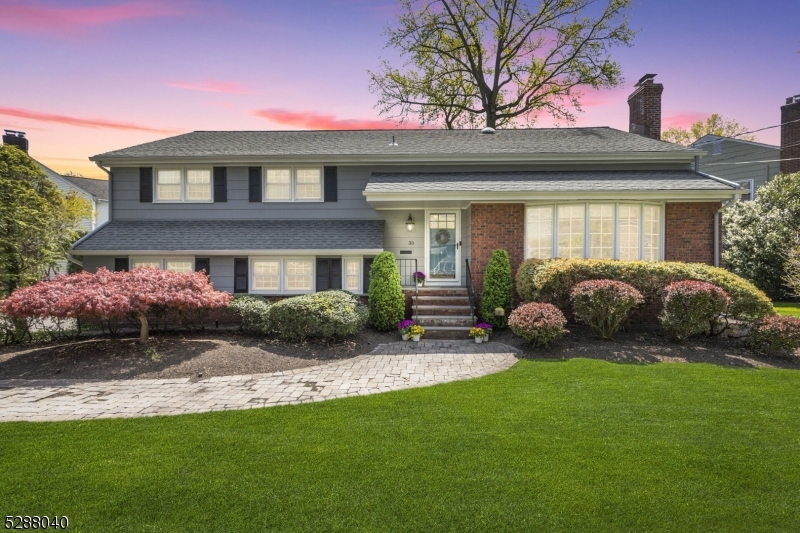 a view of a house with backyard and porch