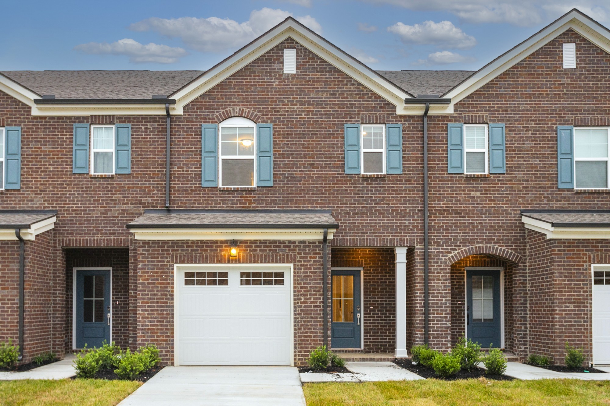 a front view of a house with yard