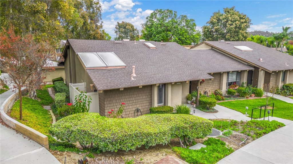 a aerial view of a house with a yard and plants