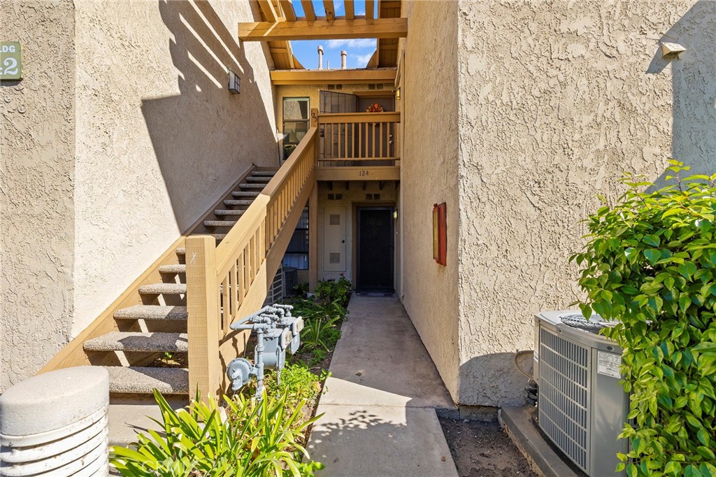 a view of an entryway with wooden floor and a potted plant