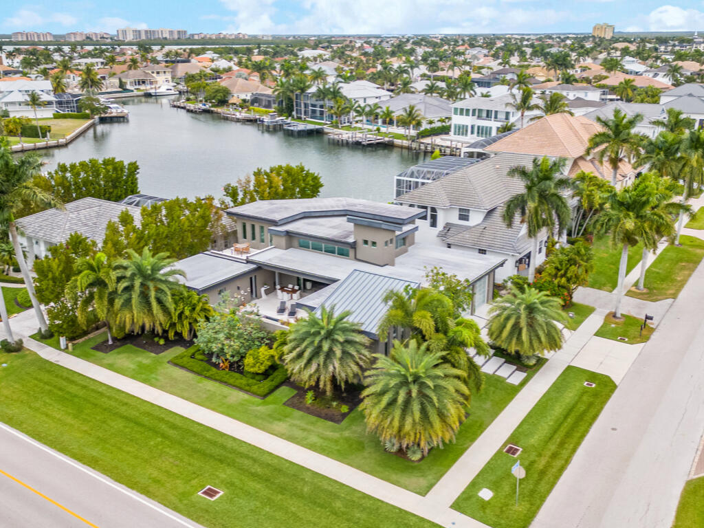 an aerial view of a house with a lake view