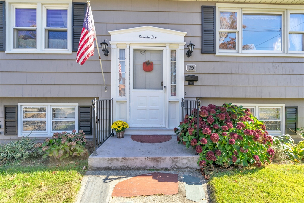 a view of a house with potted plants