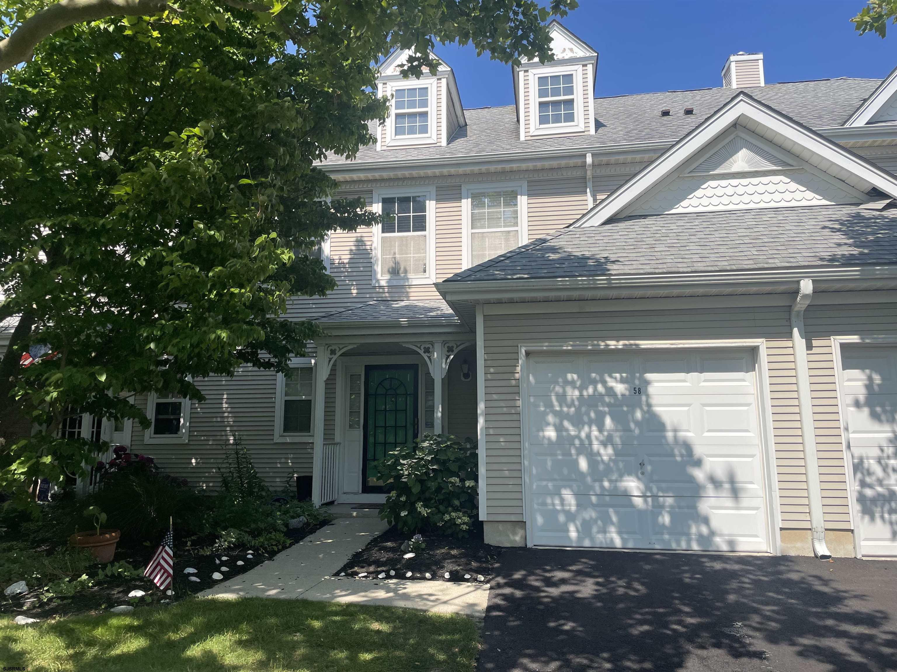 a front view of a house with yard