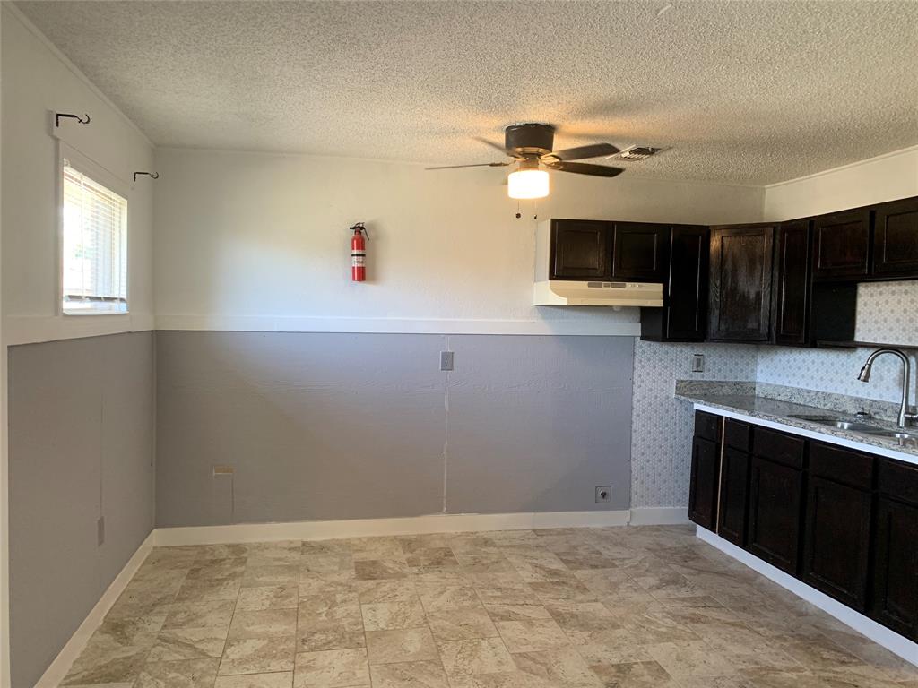 a view of a kitchen with a sink