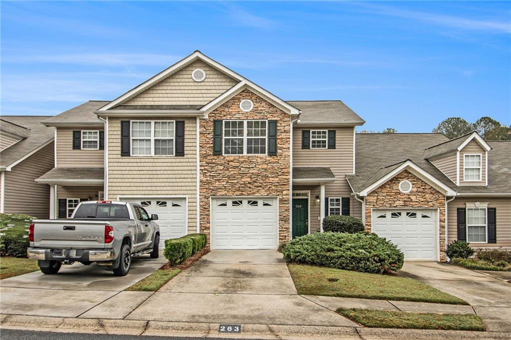 a front view of a house with a yard