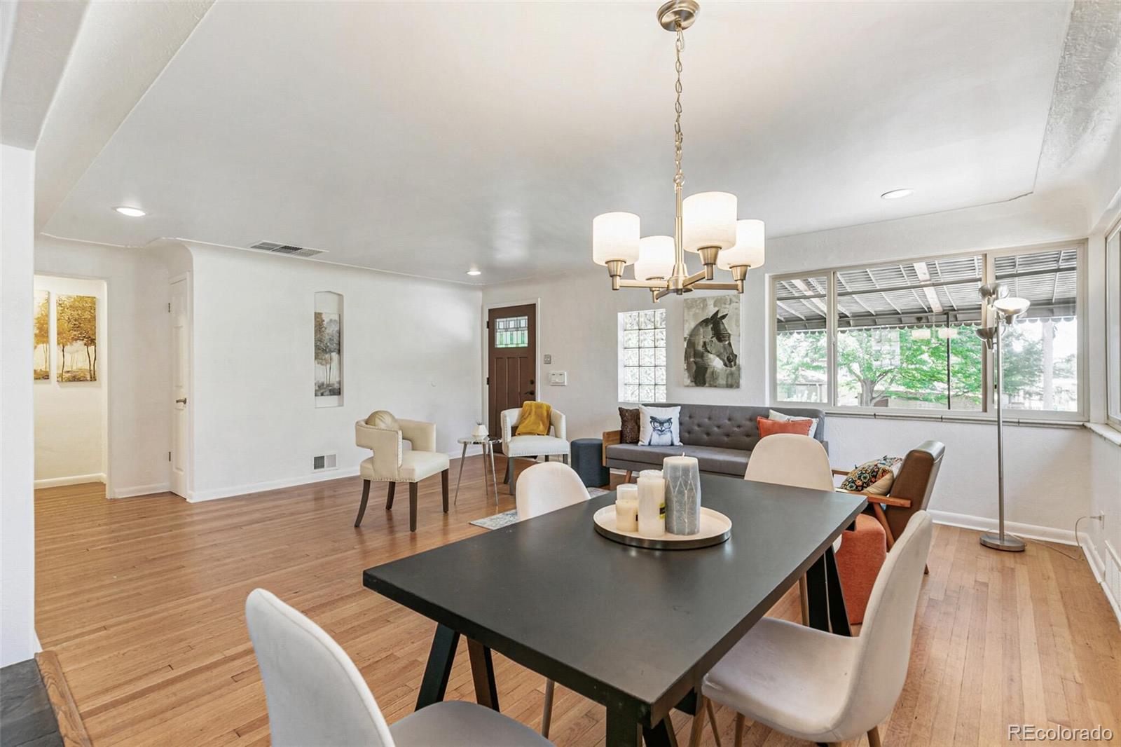 a view of a dining room with furniture window and wooden floor