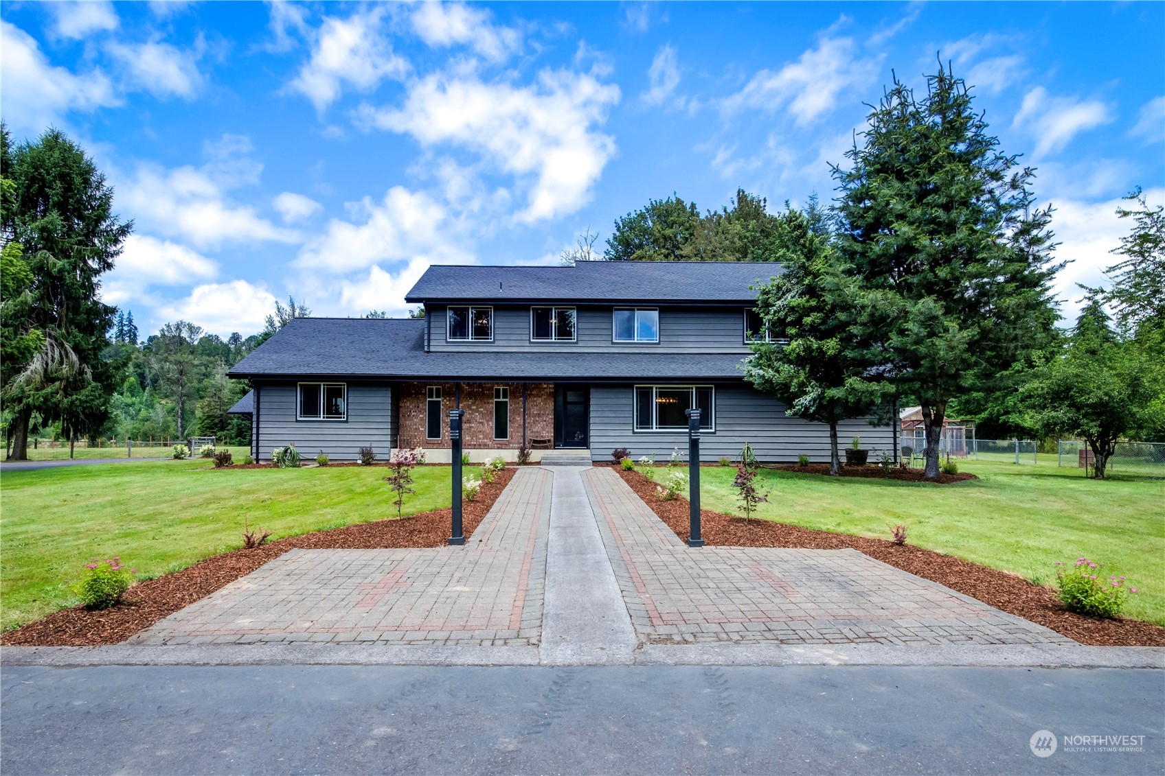 a view of a house with a yard