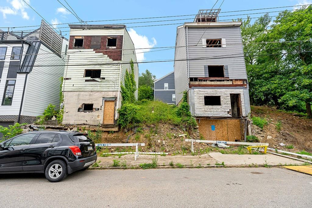 a view of a car parked in front of a house