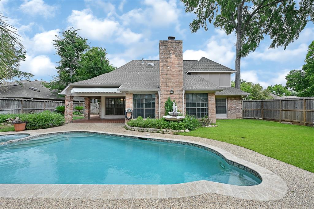 Covered patio and added privacy views of a corner lot