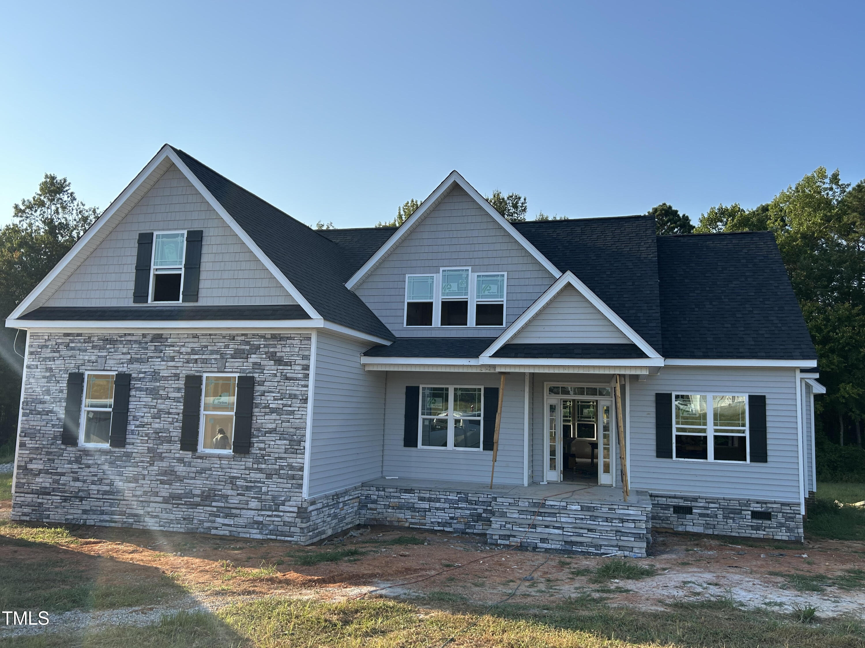 a front view of a house with yard