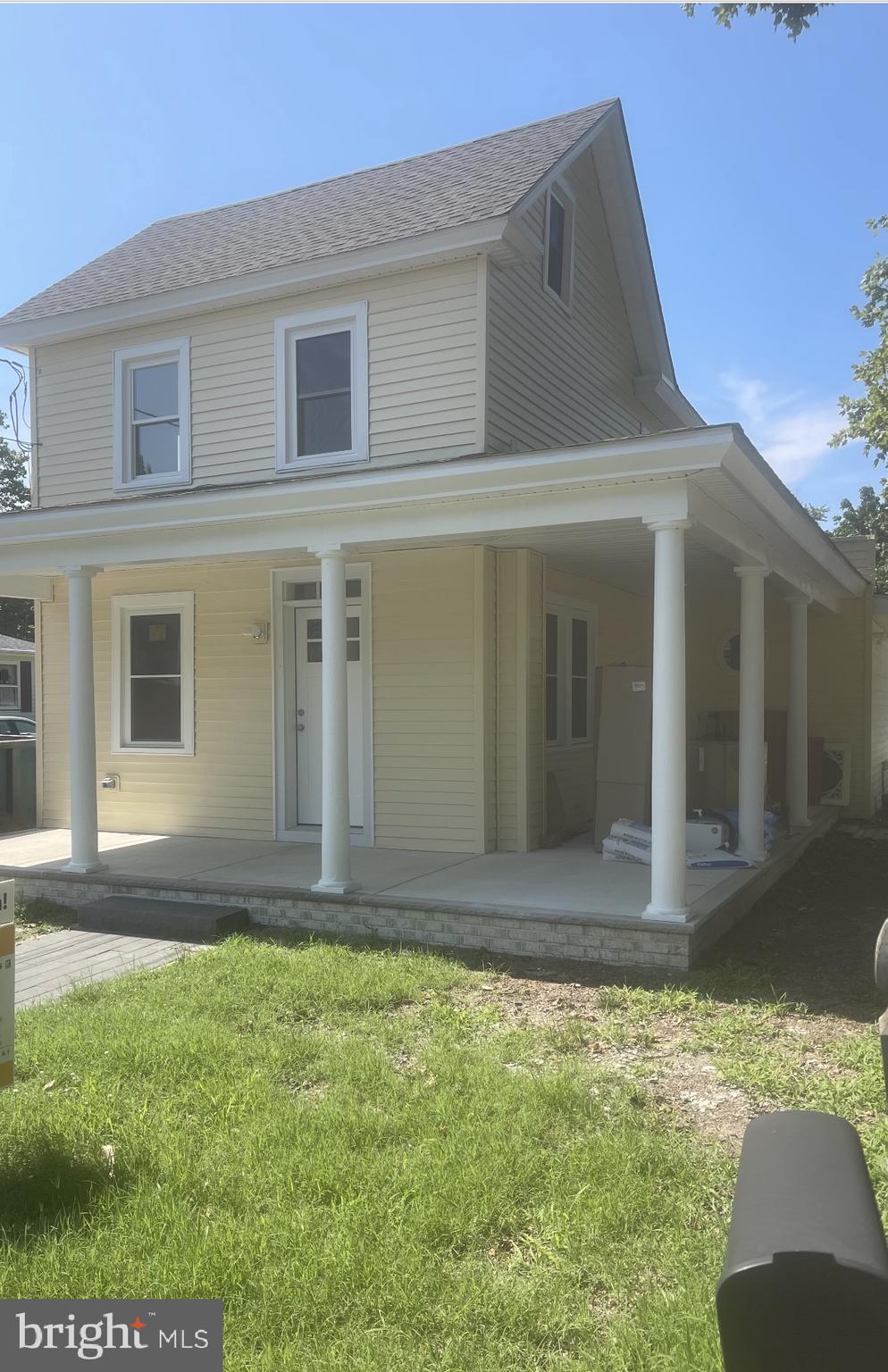 a view of house with yard