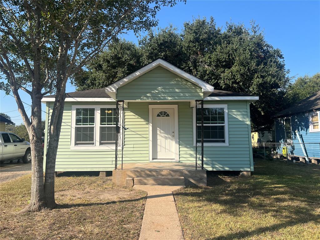 a front view of a house with yard