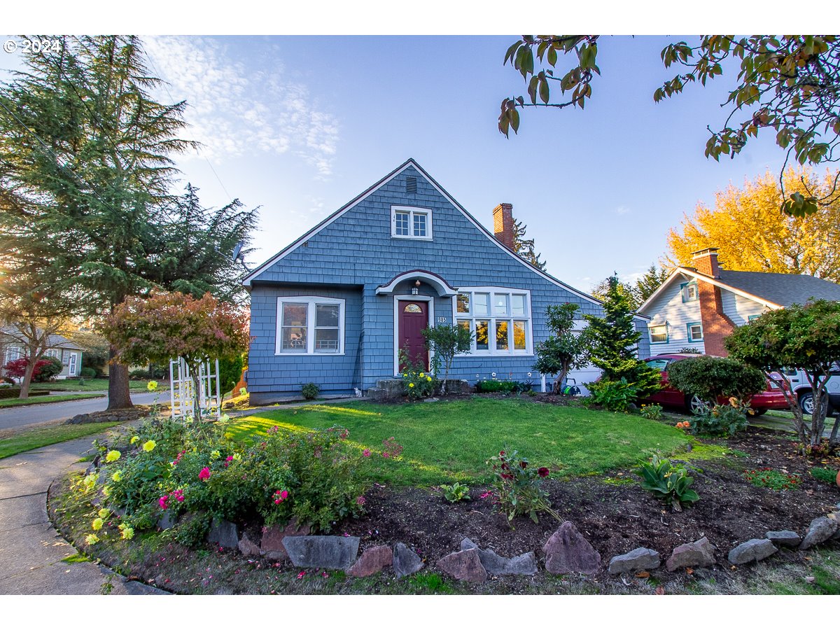 a front view of a house with garden