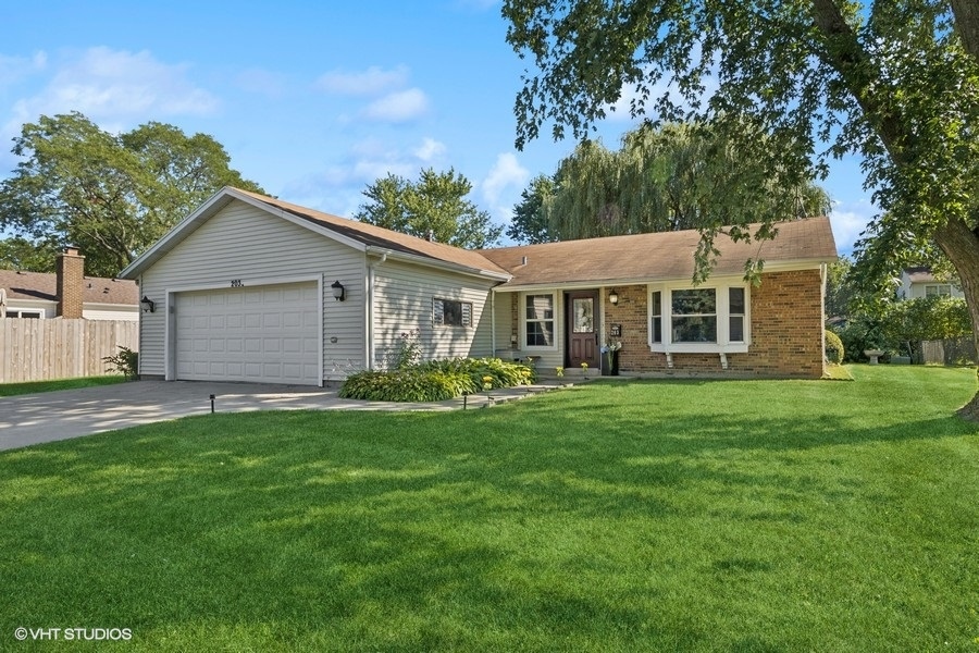 front view of a house with a garden