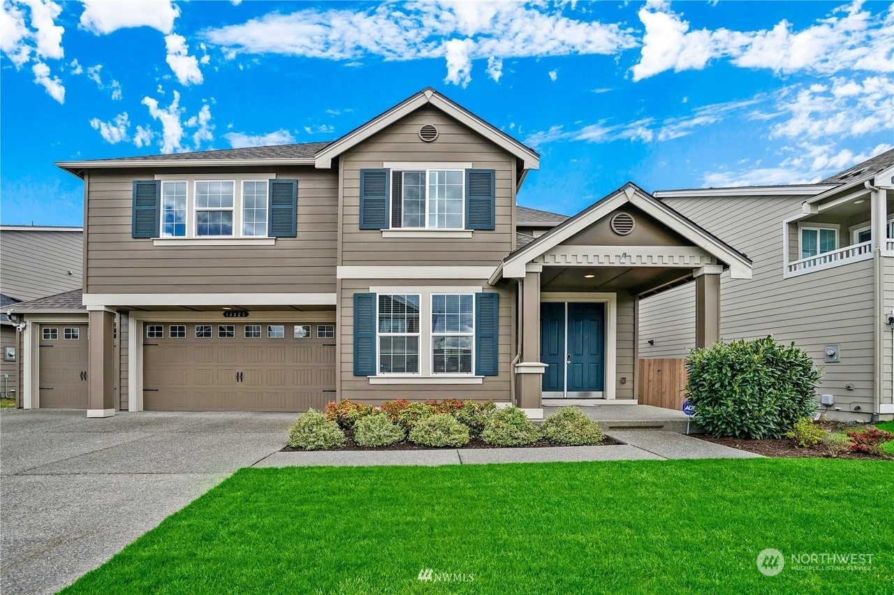 front view of a house with a yard