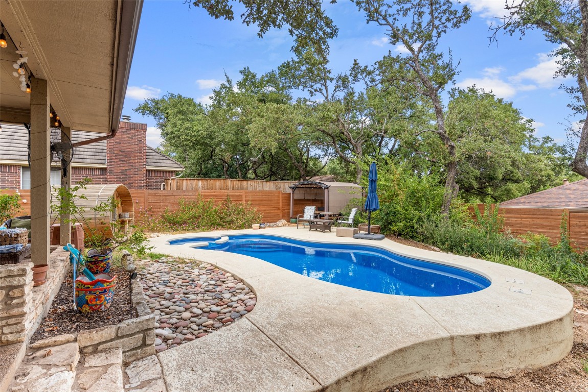 a view of a swimming pool with a lounge chair