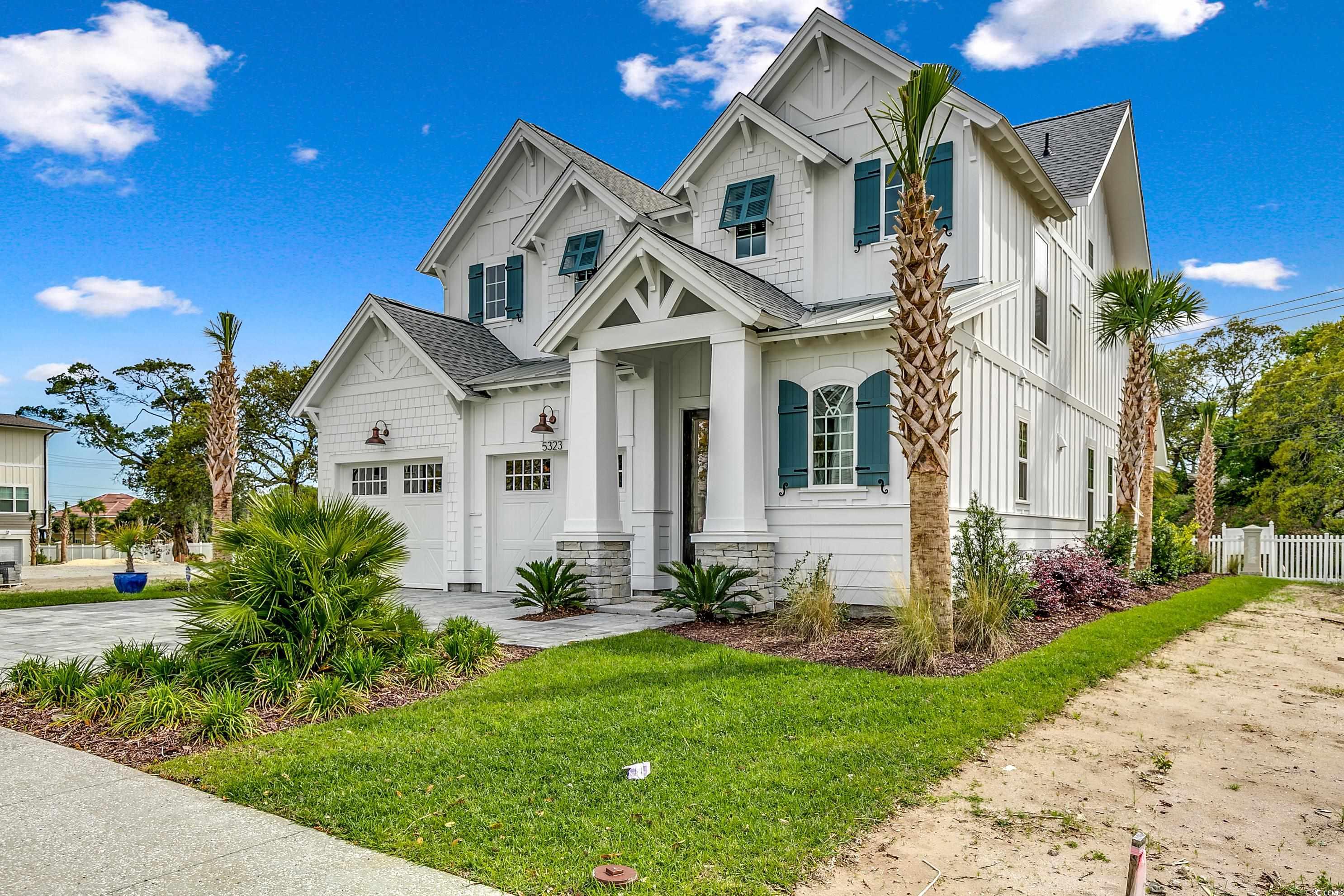 View of front of property featuring a front yard a