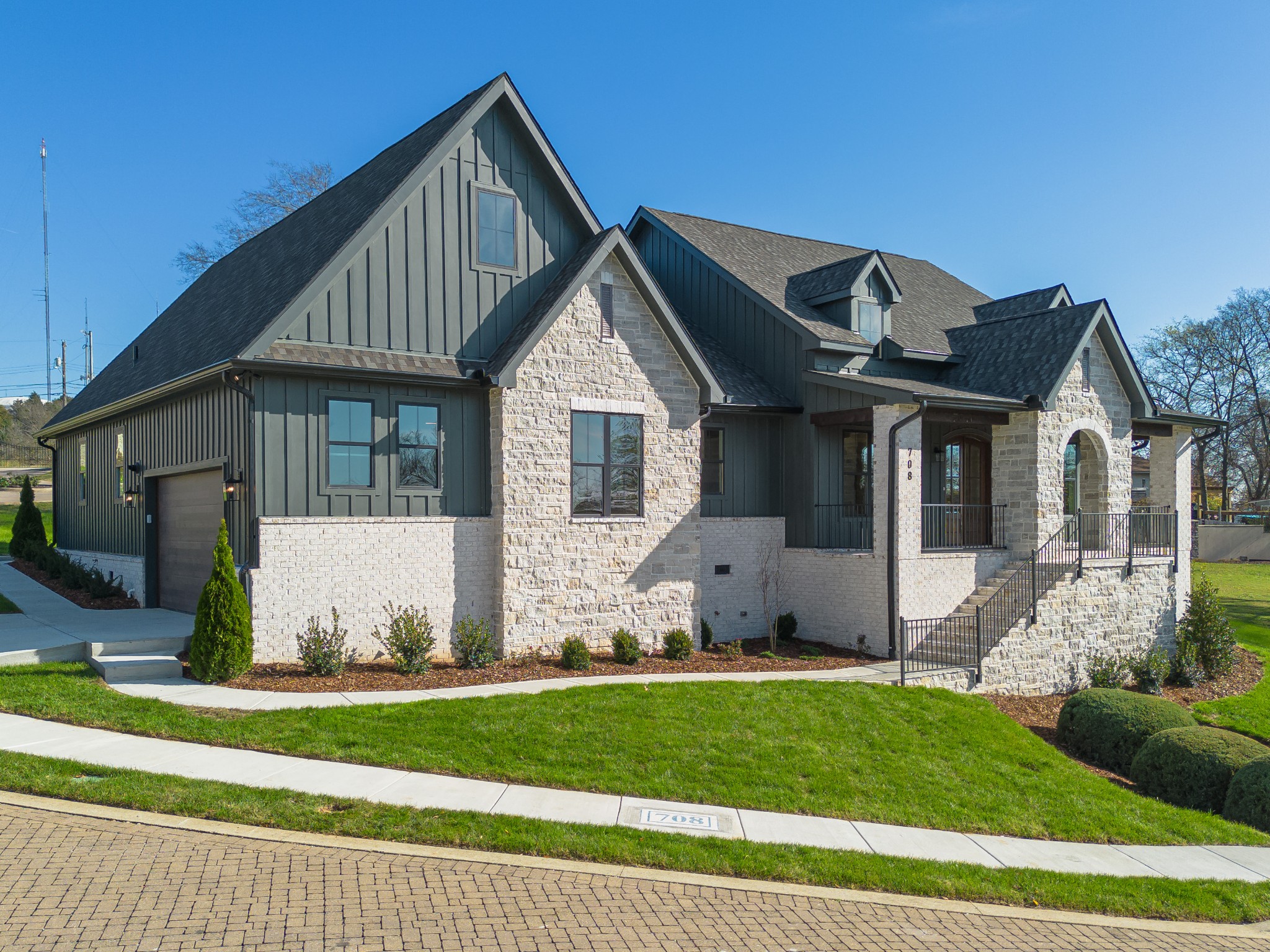 a front view of a house with a yard