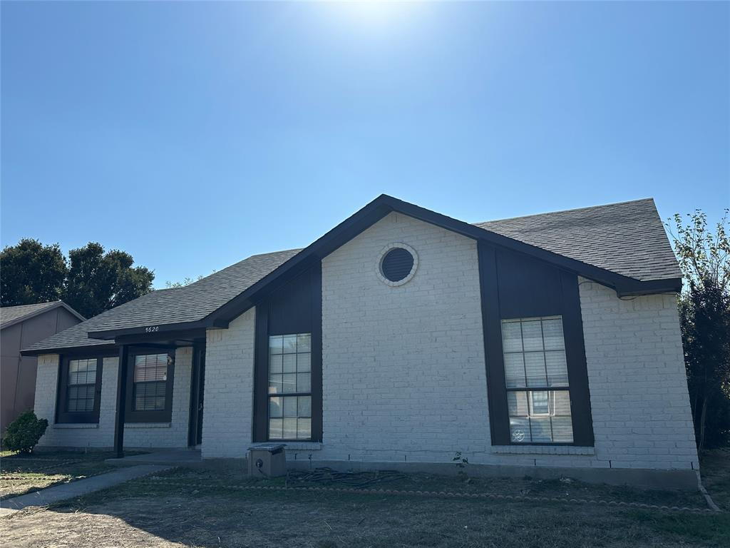 front view of a house with a dry yard