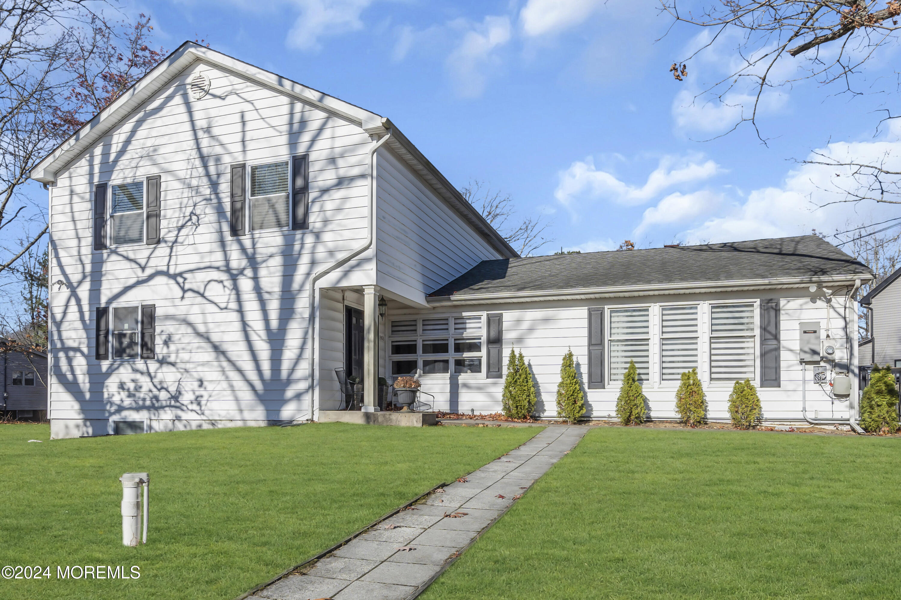 a view of a house with a yard