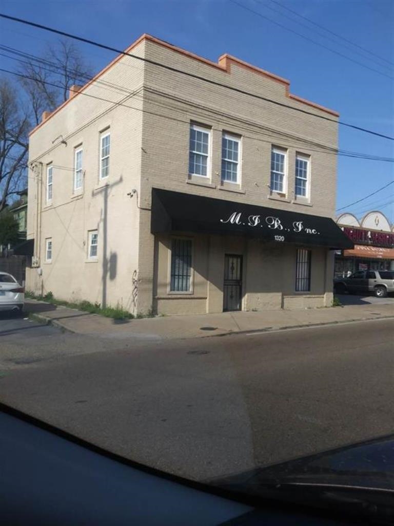 a view of a building with a street