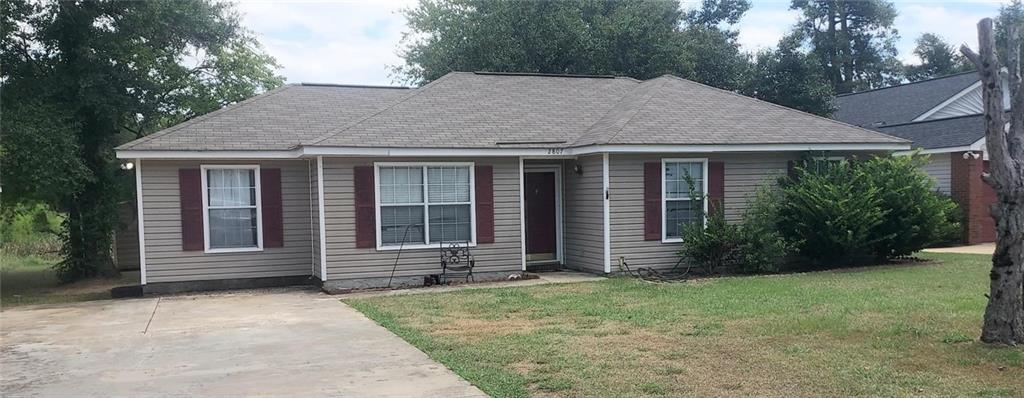 front view of a house with a yard