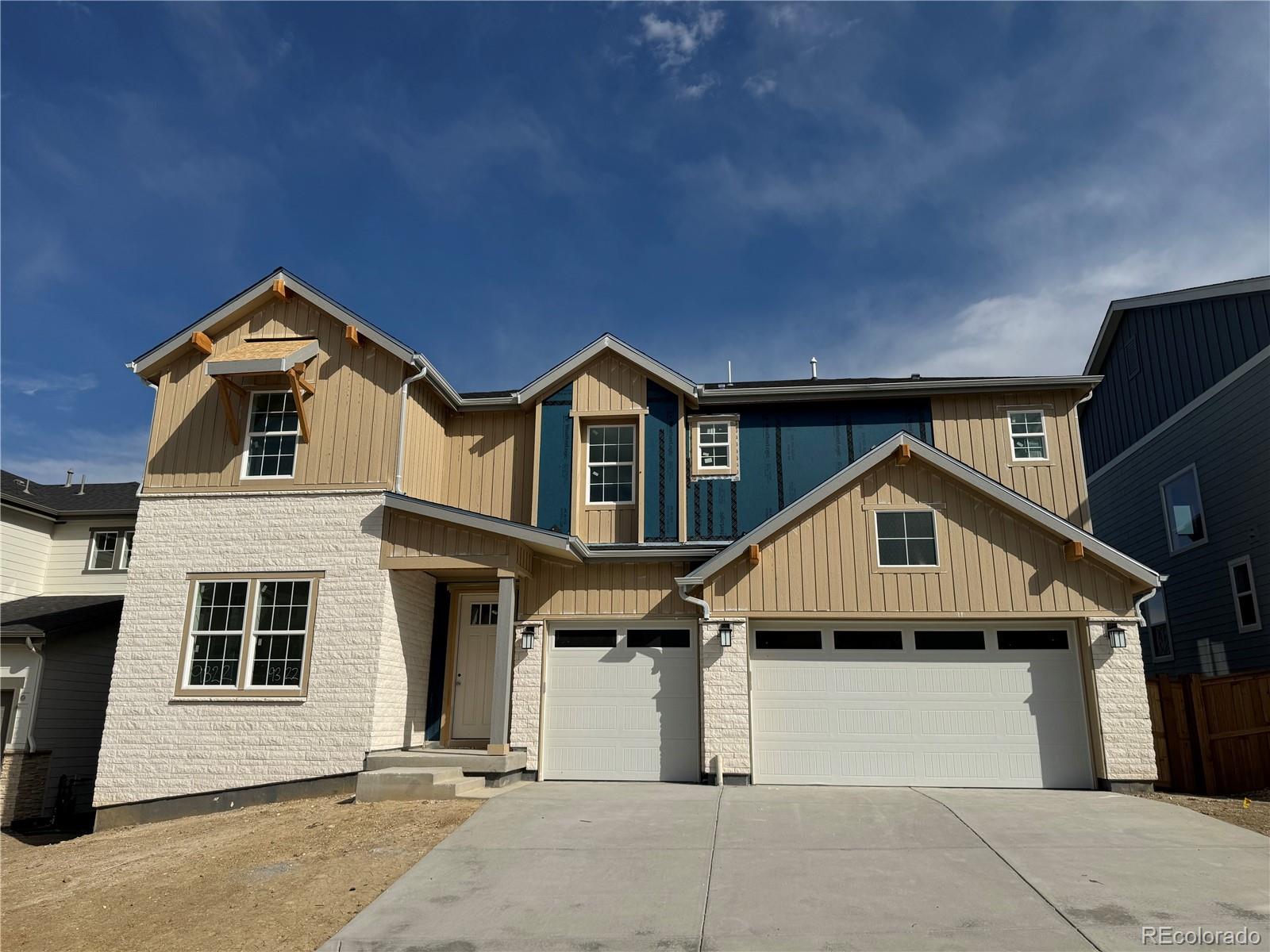 a front view of a house with a garage