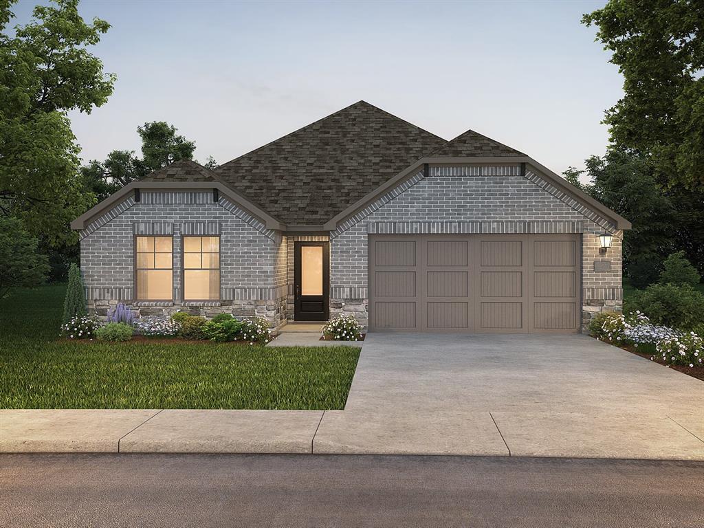 a front view of a house with a garden and garage