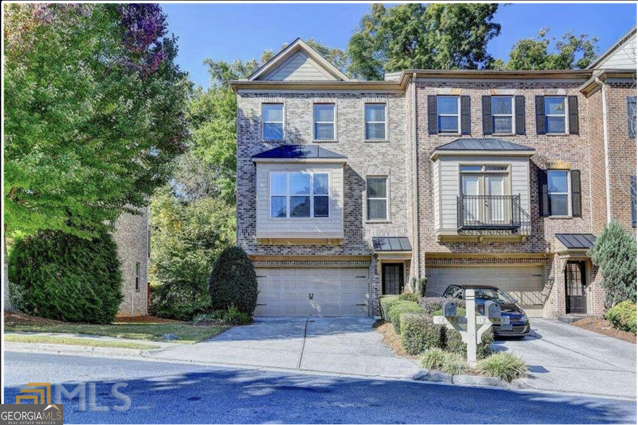 a front view of a house with yard