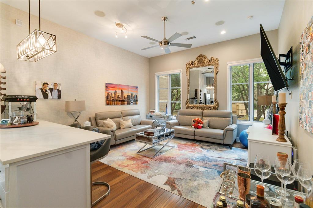 a living room with furniture fireplace and a flat screen tv