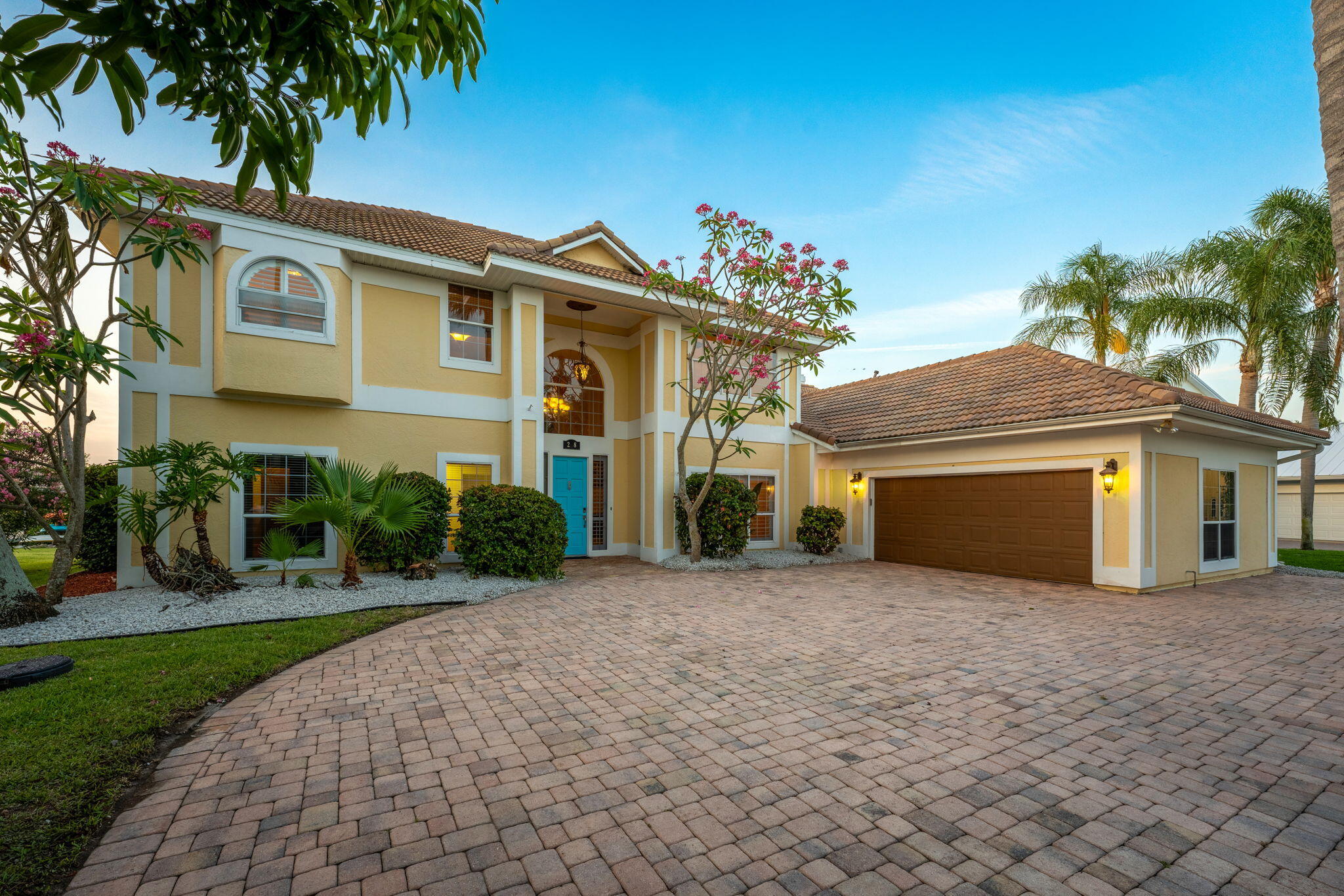 front view of a house with a garden