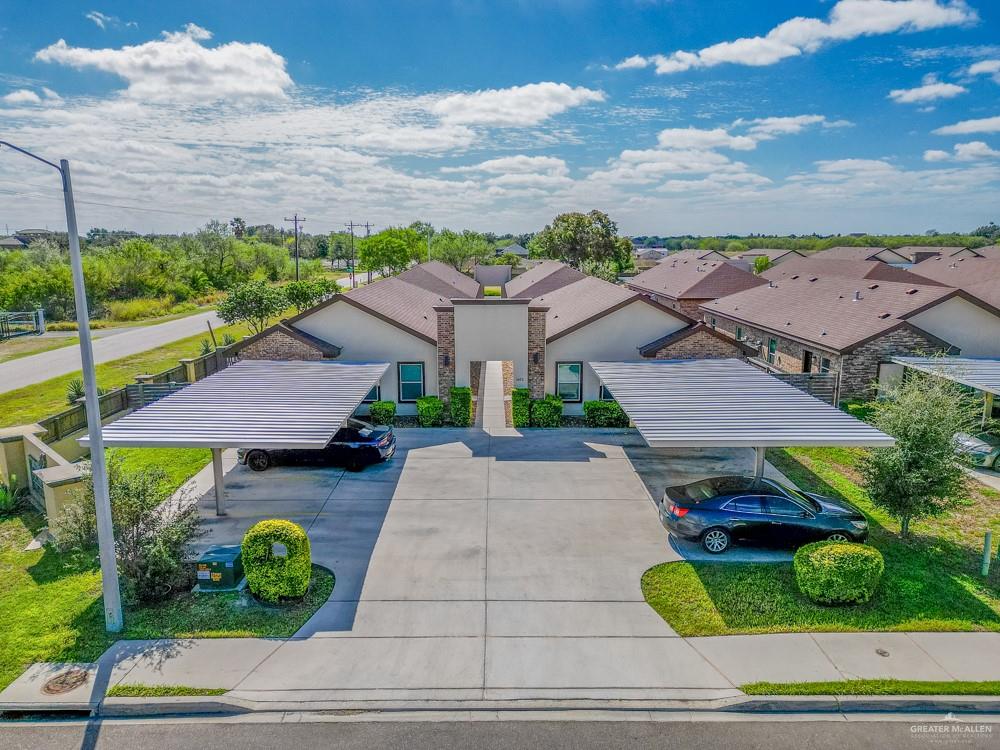 a aerial view of a house with garden space and street view