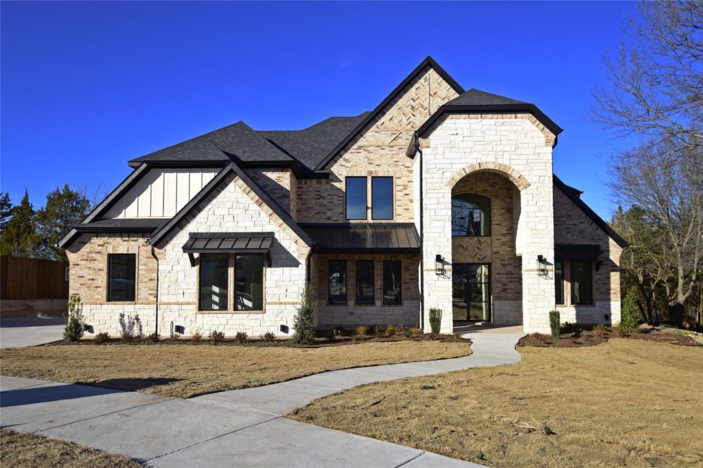 a front view of a house with yard