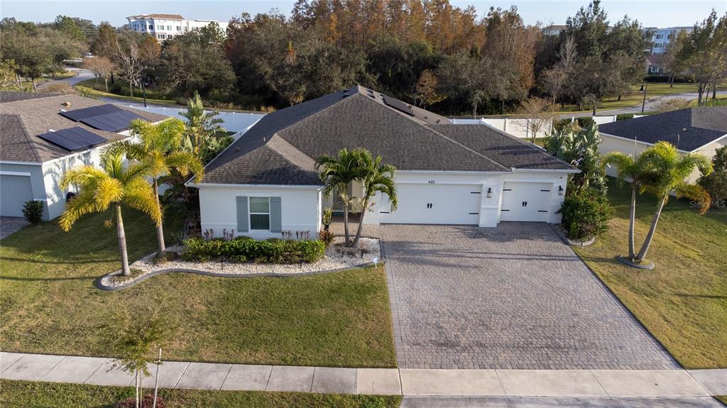 a aerial view of a house with garden and plants