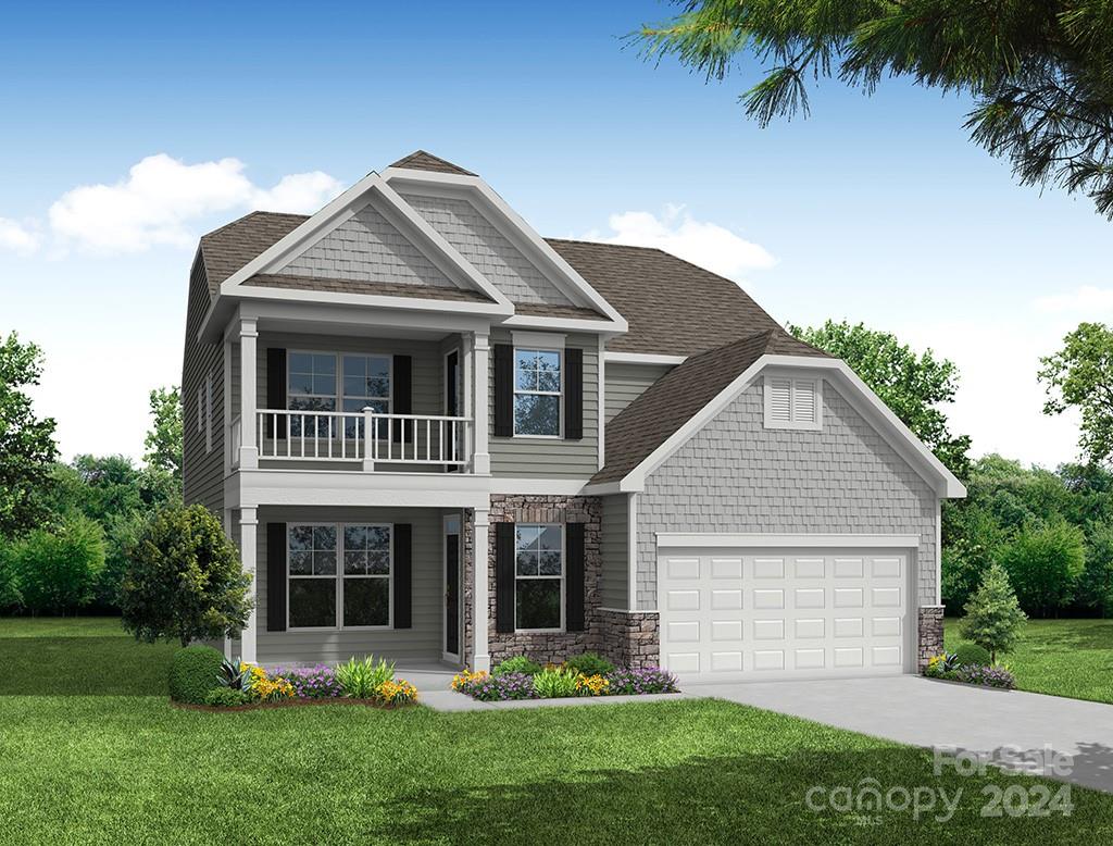 a front view of a house with a garden and plants