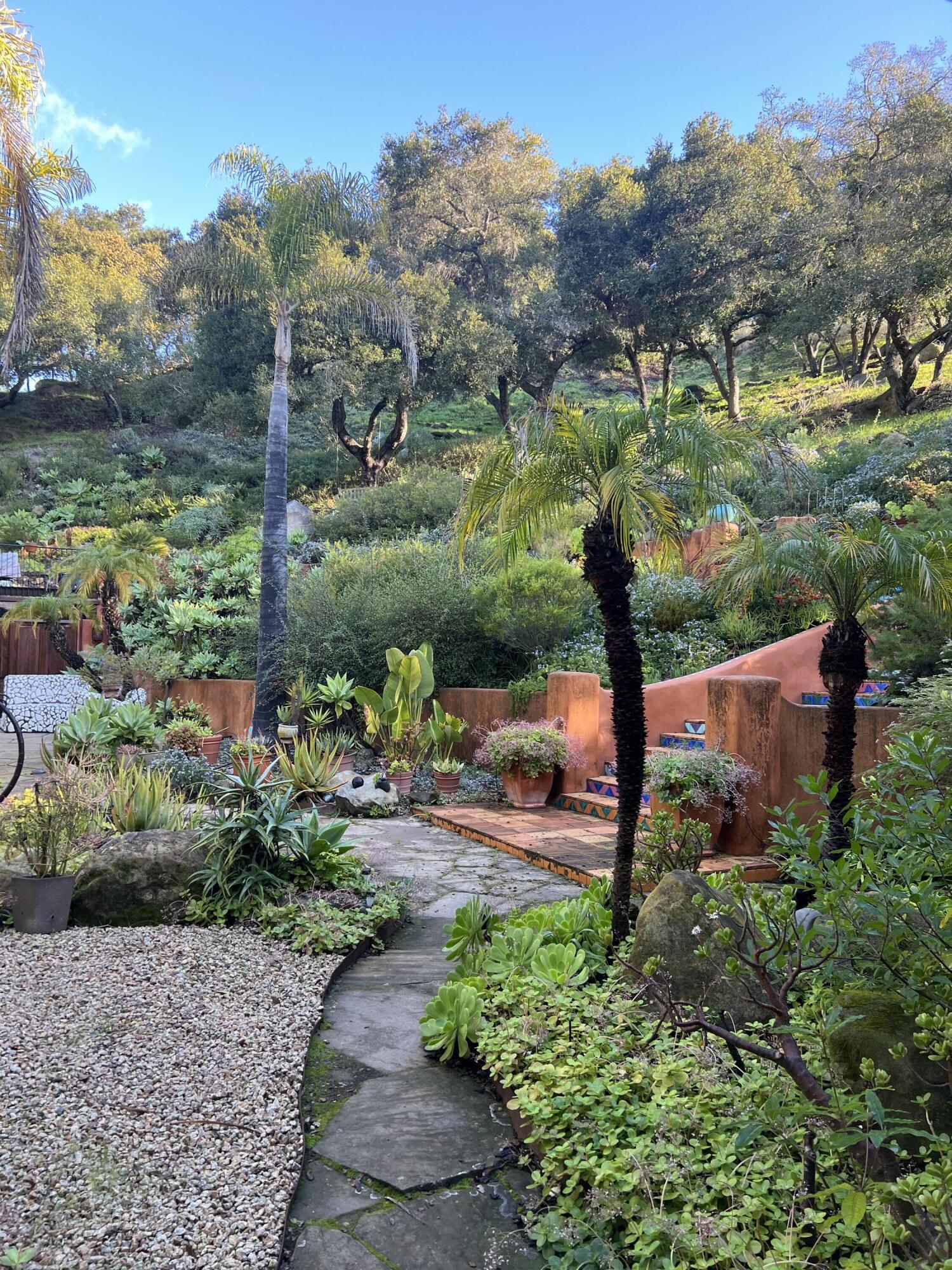 a view of a garden with a lake view