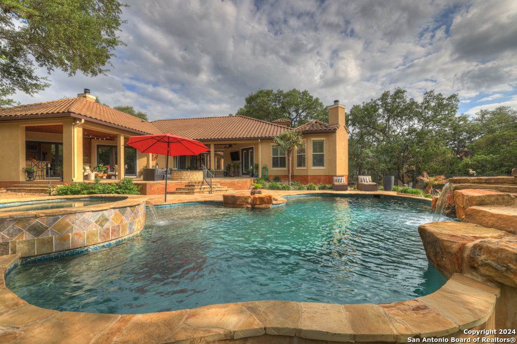 a view of a swimming pool with a patio