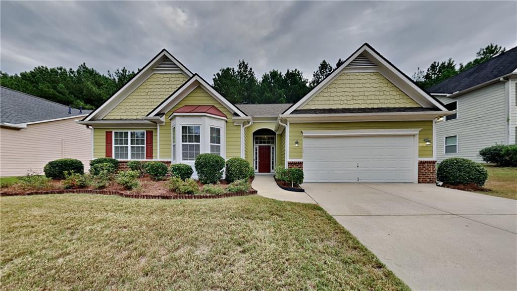 a front view of a house with a yard