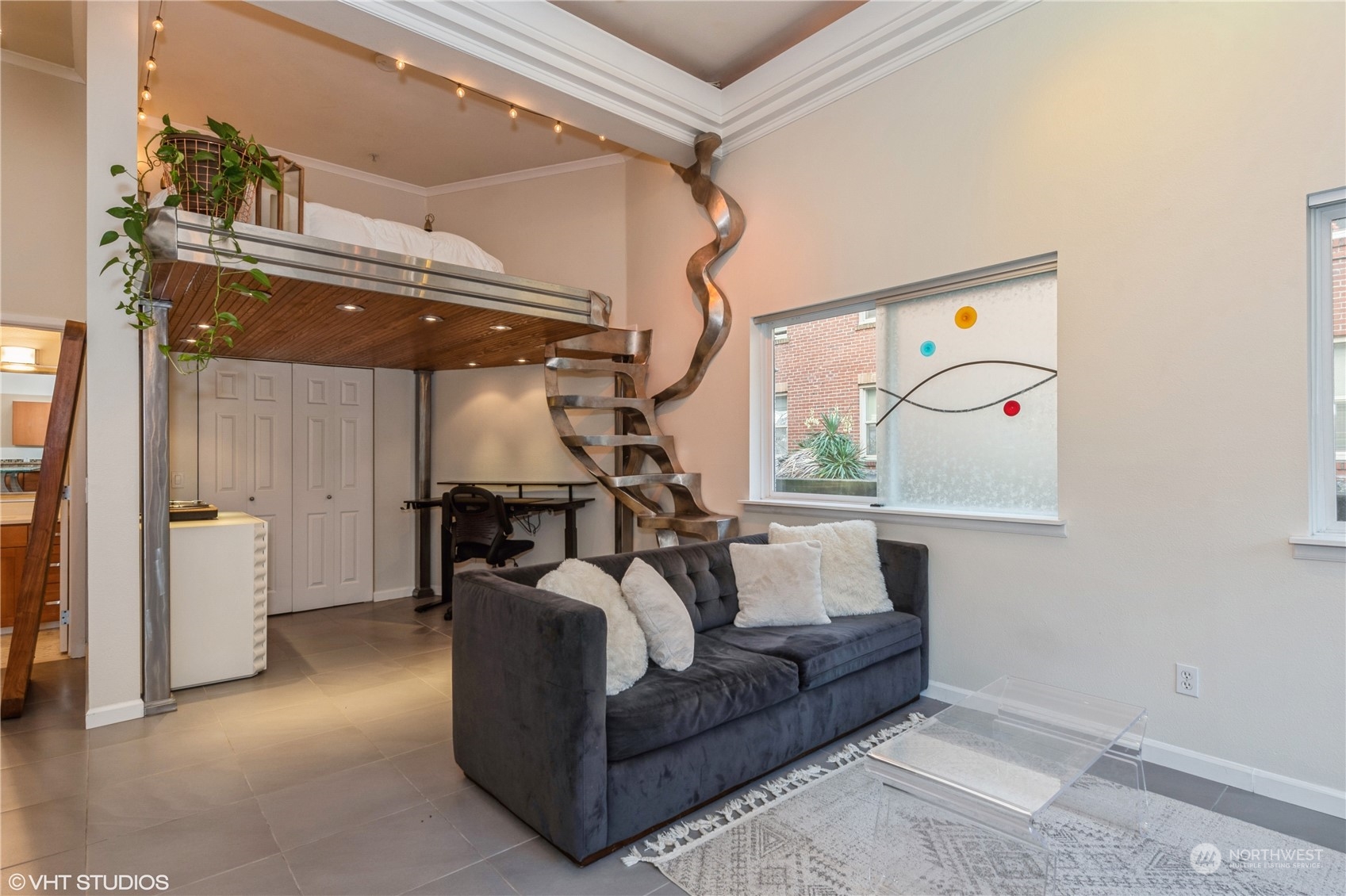 a living room with furniture and a window