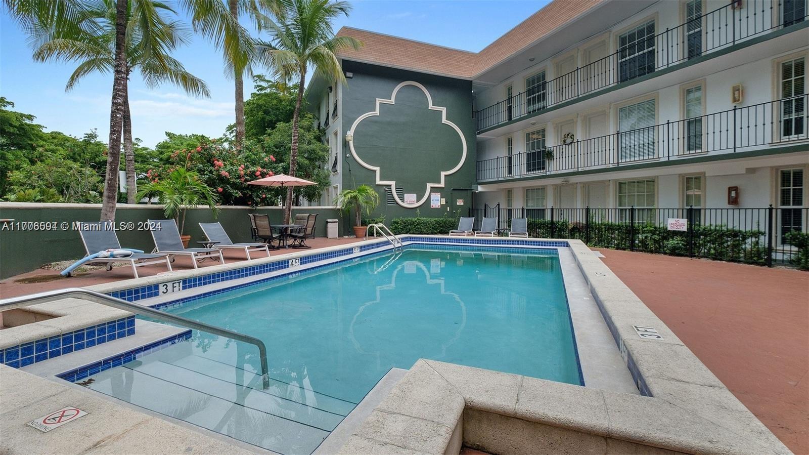 a swimming pool with outdoor seating and yard