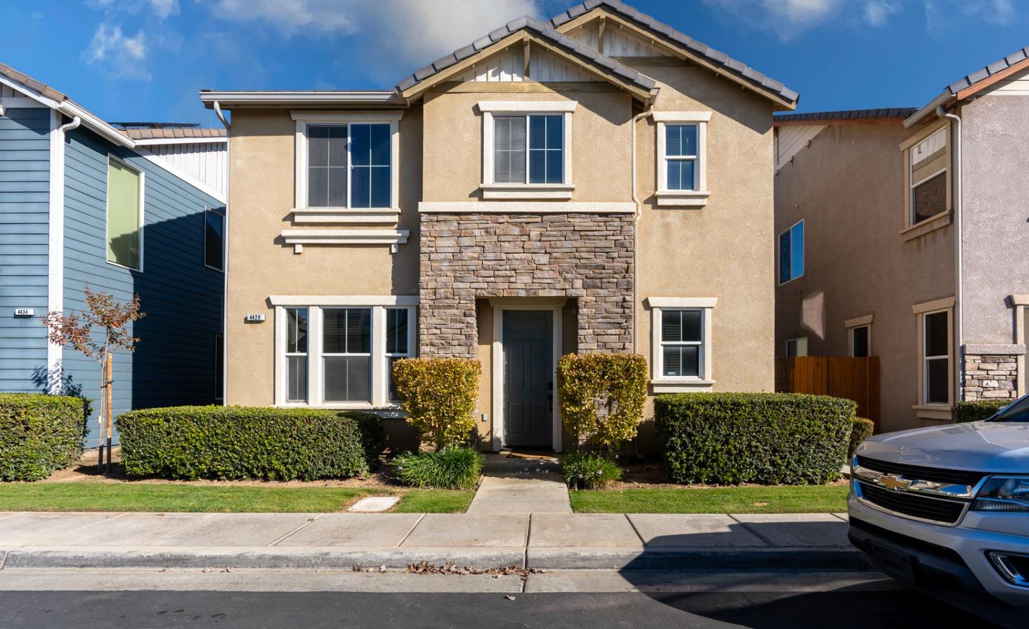 a front view of a house with a yard