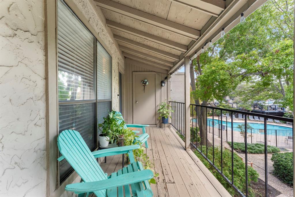 a view of a chair and table in the balcony