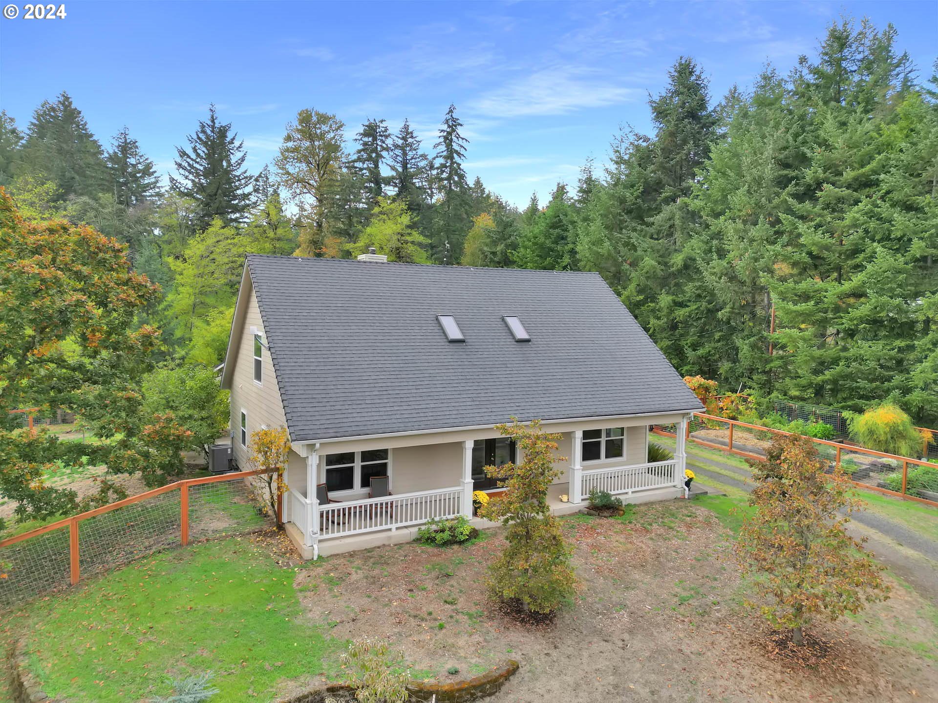 aerial view of a house with a yard