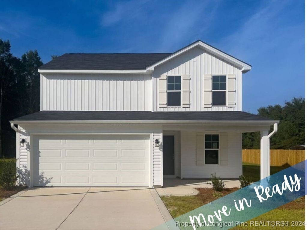 a front view of a house with a garage