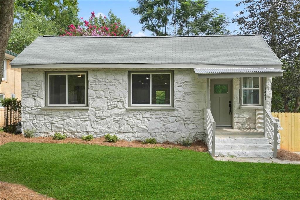 a front view of a house with garden