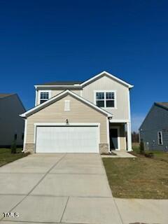 a front view of a house with garage